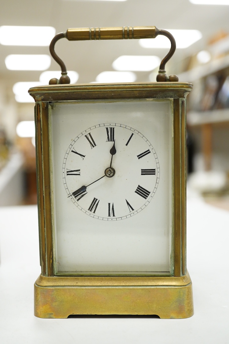 A cased brass carriage timepiece, 17.5cm high